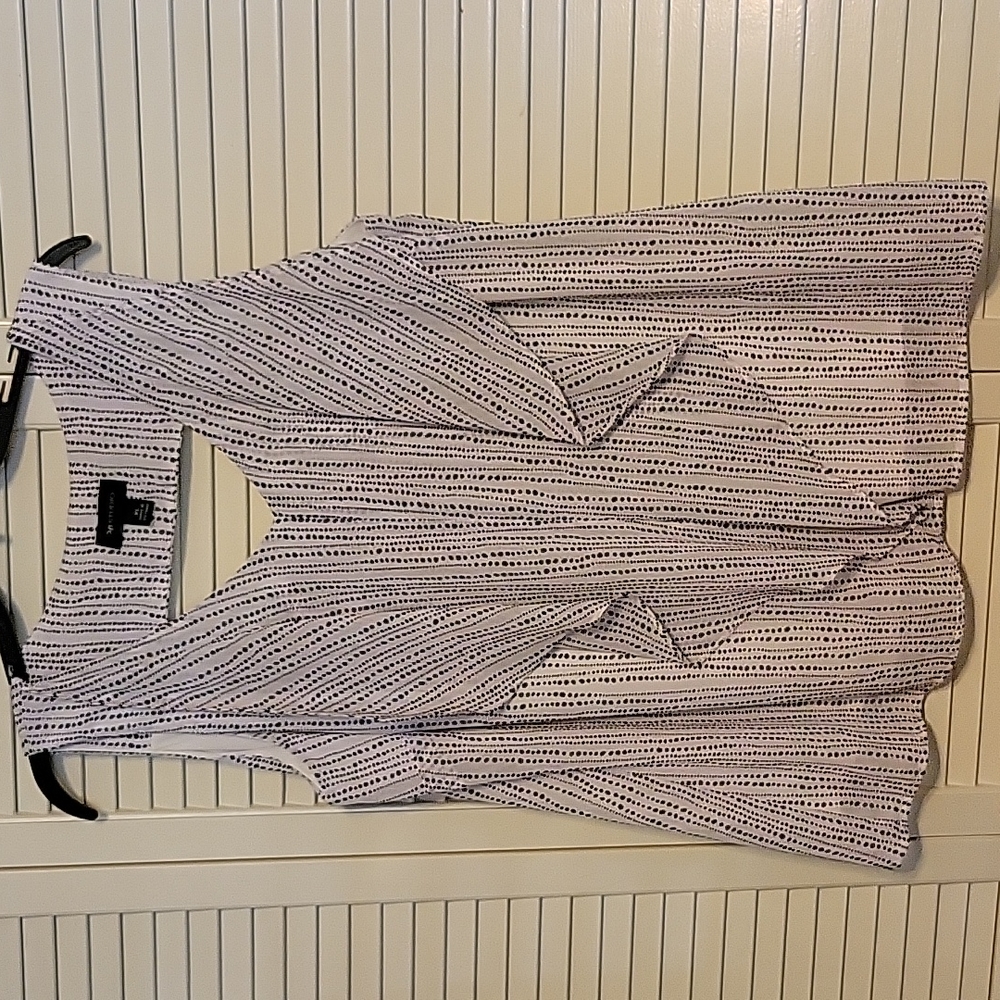 Sleeveless top with ruffle accents.